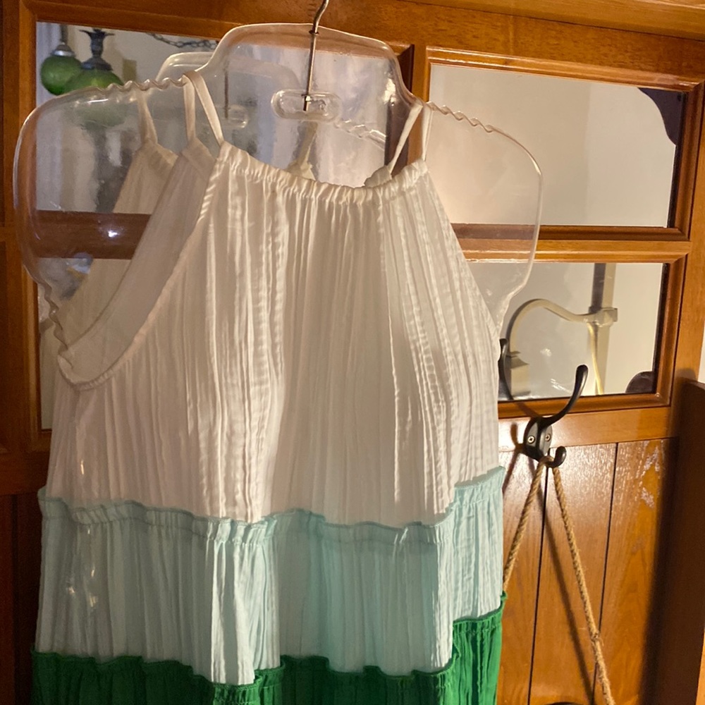 This is a long dress, white-green’s and blues. It’s a size XS Est. 1946